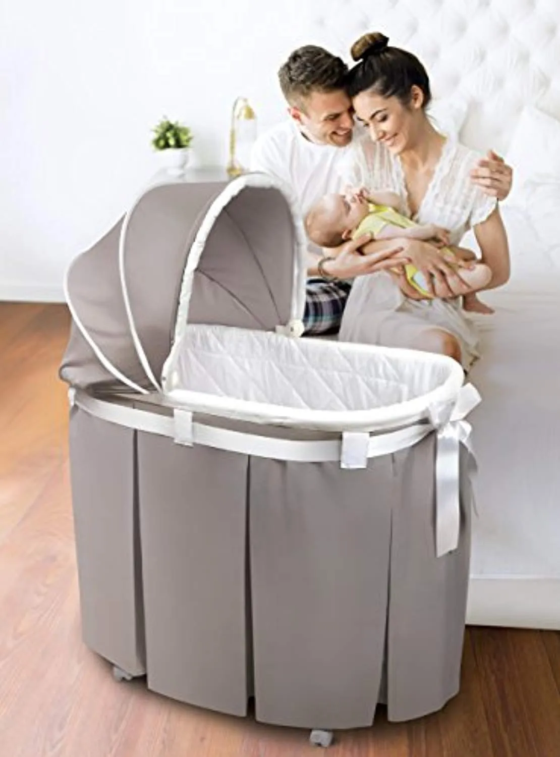 Oval Rocking Baby Bassinet with Bedding, Storage, and Pad